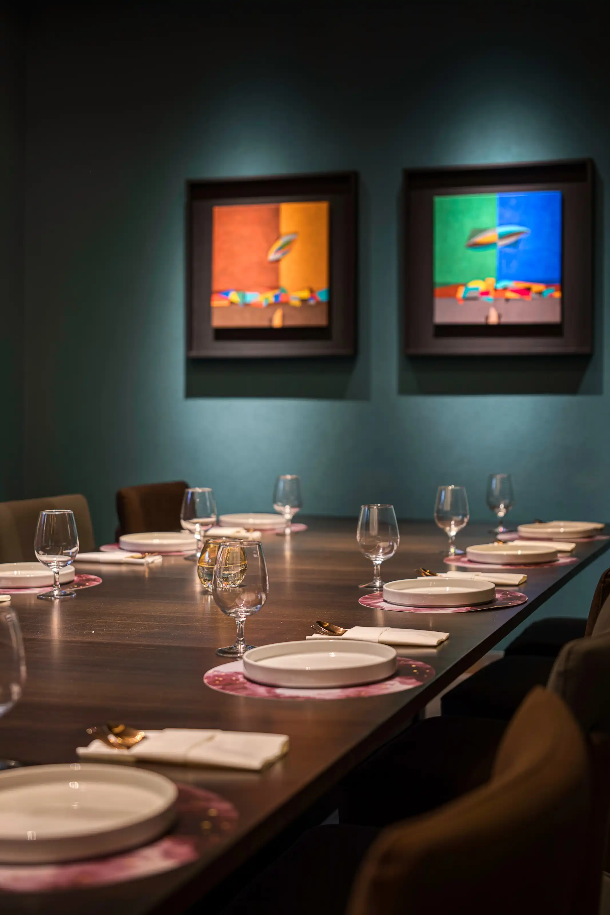 Booth seating framed by abacus-bead timber screens under warm pendant lighting